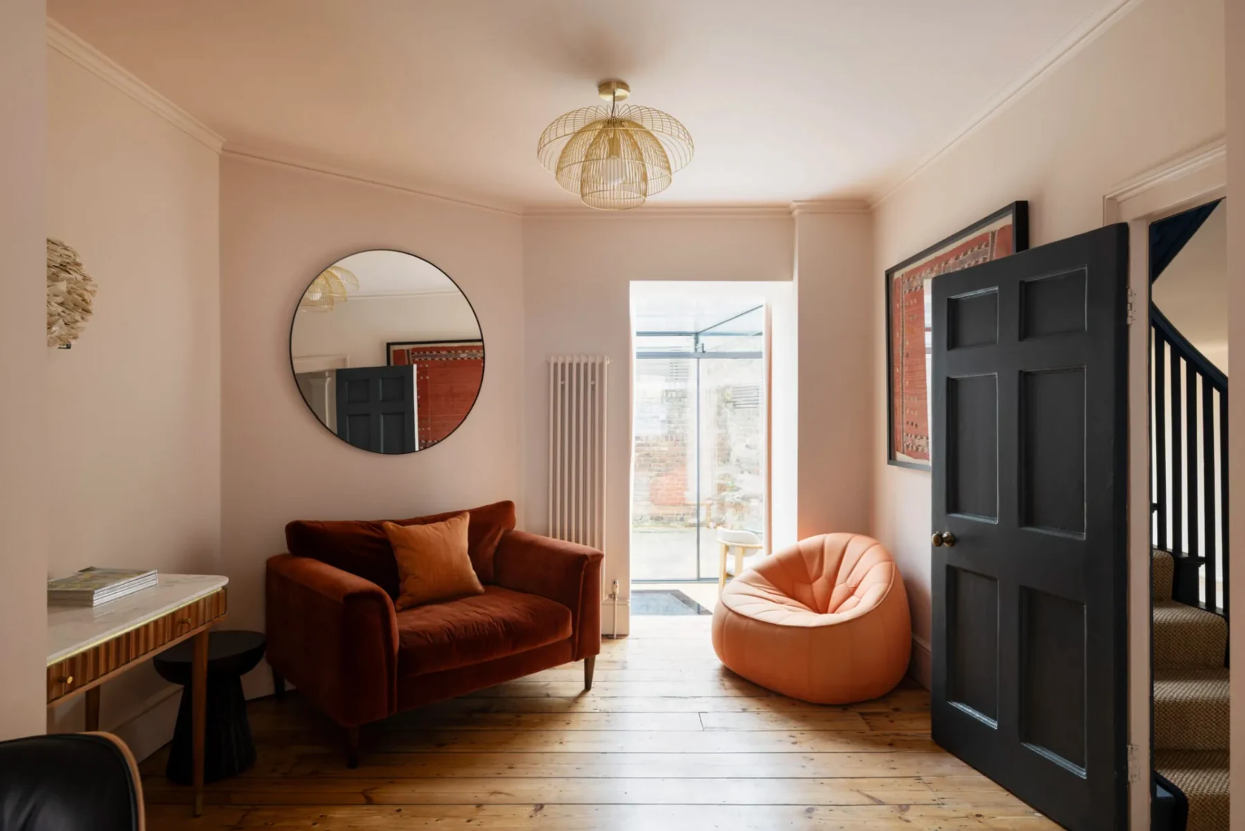 Refurbished residential living room with restored timber flooring and contemporary furnishings