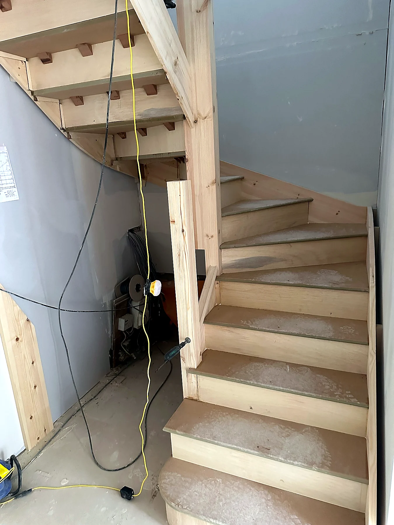 New timber staircase under construction within a residential refurbishment